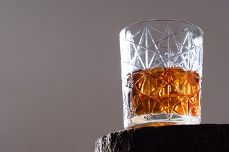 old-fashioned-cocktail-garnished-with-orange-isolated-grey-background